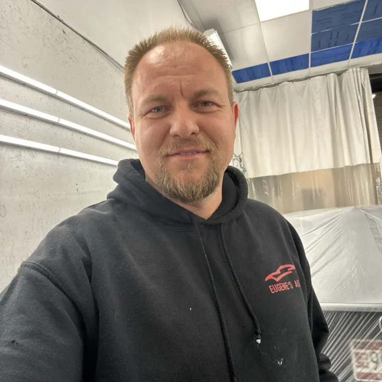 Eugene, owner of Eugene's Auto, at the shop