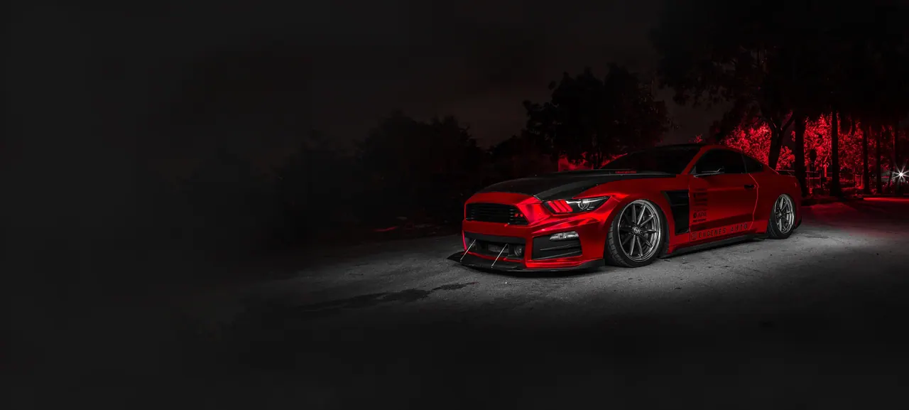 Red Ford Mustang finished by Eugene's Auto