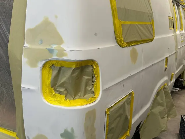 White van side panels prepped with primer and filler